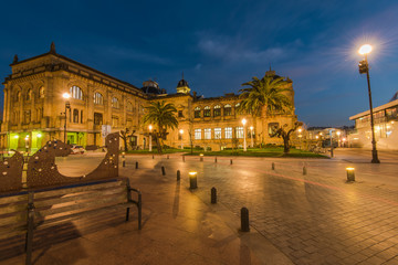 Illuminated City Hall in San Sebastian at twilight