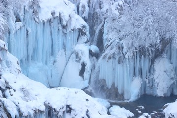 Fototapeta na wymiar Frozen waterfalls on Plitvice lakes, winter scene