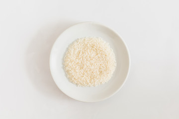 Fototapeta na wymiar rice in white plate on white background