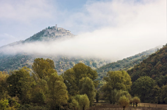 Labro village on hill covered with clouds, Lazio, Italy