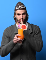 Fototapeta premium bearded pilot with cocktail in glass