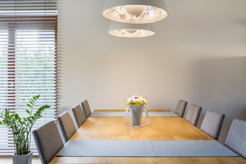 Wooden dining table and lamp