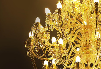 beautiful vintage crystal chandelier, the gold light in the darkness