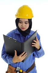Construction worker wear yellow safety helmet in serious mode while holding a file