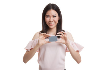 Young Asian business woman smile with  blank card.