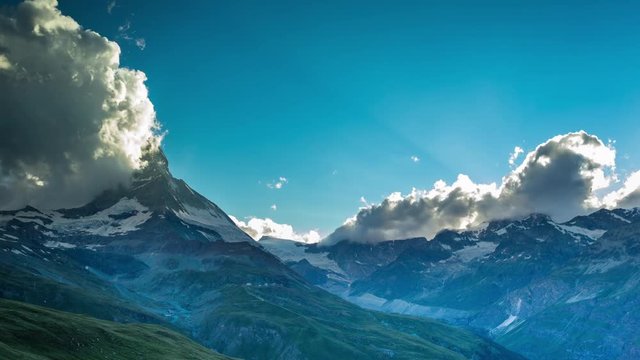 timelapse of the amazing matterhorn and surrounding mountains in the Swiss Alps with fantastic cloud formations