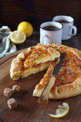 Onion cheese pie and two cup of lemon tea