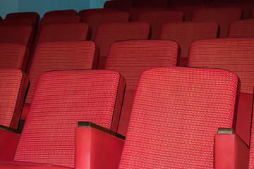 Fototapeta premium Red chairs from the tissue in an empty auditorium