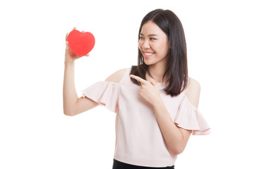 Asian business woman point to red heart.