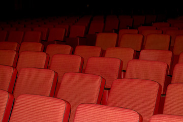 Red chairs from the tissue in an empty auditorium