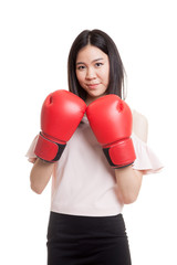 Young Asian business woman with red boxing gloves.