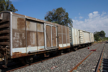 Fototapeta na wymiar Old freight train wagons on railway tracks