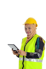 Construction worker wear yellow safety helmet smile and look forward while looking a tablet