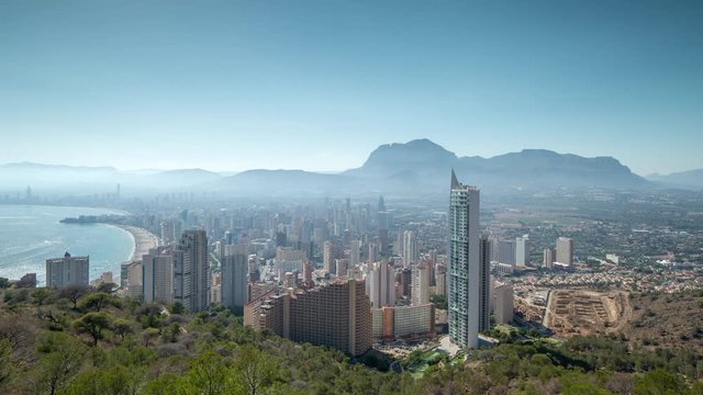 timelapse of the coast and high rise skyline of benidorm seaside resort, shot from a high vantage point, spain