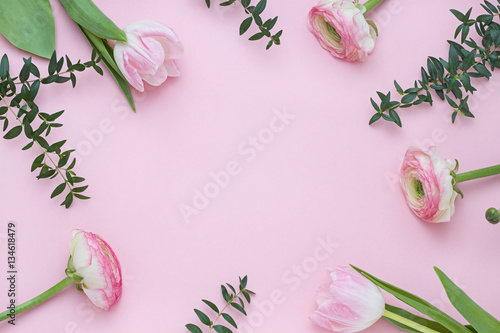 Pink floral frame and background. Top view
