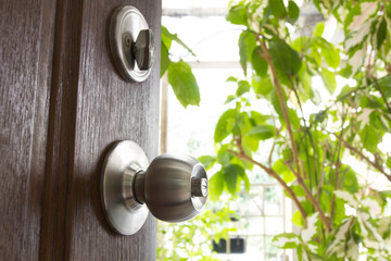 doorknob and bolt or latch with wooden door for security
