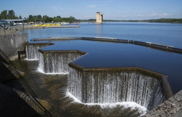 Waterfall at manmade lake in Strathclyde country park in Lanarkshire Scotland. 