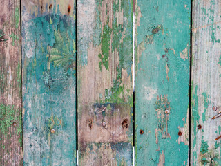 Wooden background of old fence with rusty nails. Shabby texture