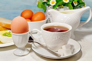 Easter- traditional Easter breakfast - Festive Easter table in white - soft focus, selective focus