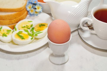 Easter- traditional Easter breakfast - Festive Easter table in white - soft focus, selective focus