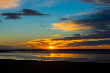 Fototapeta na wymiar Sunset on Iceland Beach with Beautiful Sky in Winter