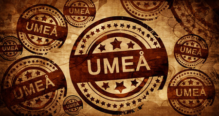 Umea, vintage stamp on paper background