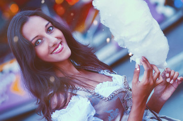 Gorgeous brunette holding cotton candy