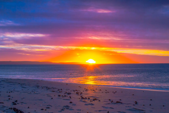 Red sunset over beach