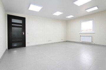 Interior empty office light room with white wallpaper unfurnished in a new building