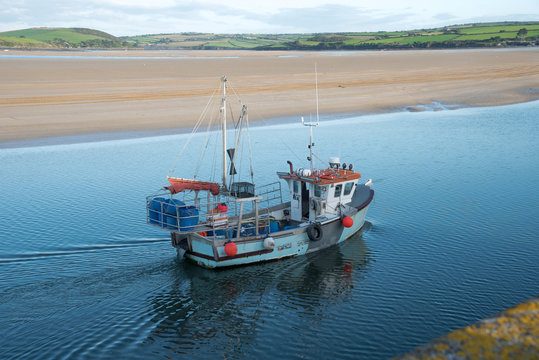 Fishing boat arrives in the port of Padstow at the Camel estuary in north Cornwall.