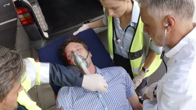 Paramedic using an external defibrillator 