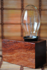 Wooden rectangular lamp with a lamp of Edison.
