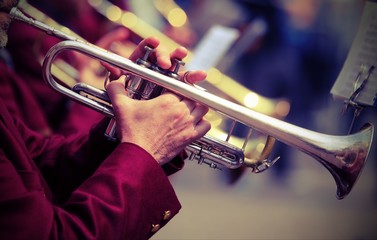 trumpeter plays his trumpet in the brass band - obrazy, fototapety, plakaty