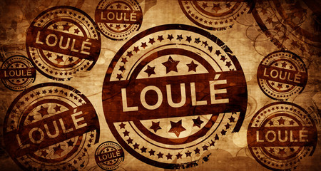 Loule, vintage stamp on paper background