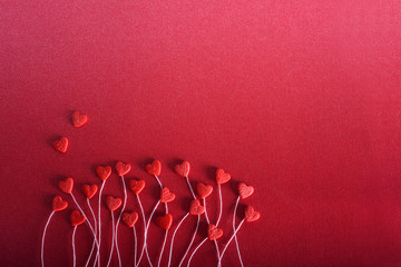 Romantic hearts on a red background. The concept for Valentine's day. Decorative card