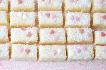 Coconut spread cookies with heart shape decoration