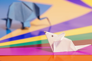 
Paper origami mouse isolated on the colorful background