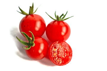 Closeup of ripe cherry tomatoes on a white background