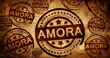 Amora, vintage stamp on paper background