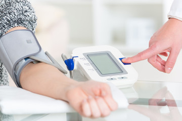 Doctor measuring blood pressure