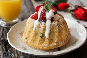 Homemade Mini Vanilla Bundt Cake topped with fresh berries and white icing / Valentine's day desserts