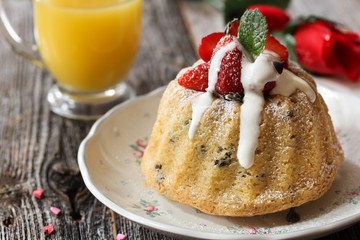 Homemade Mini Vanilla Bundt Cake topped with fresh berries and white icing / Valentine's day desserts