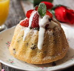 Homemade Mini Vanilla Bundt Cake topped with fresh berries and white icing / Valentine's day desserts