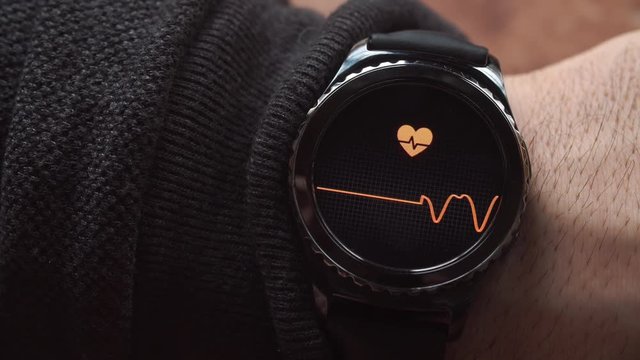 Lviv, Ukraine - January 2017: Smartwatch showing the heart rate to the user.