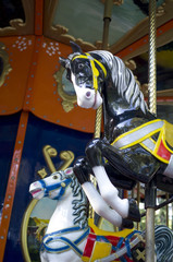 Two colorful carousel horses on funfair