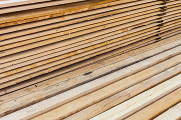 Stack of wooden terrace planks at the lumber yard.