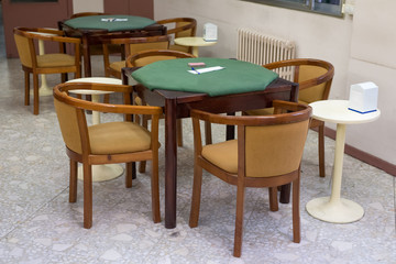 tables with green cloth in the club