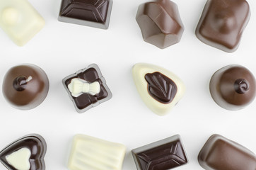Top View Of An Assortment Of Fine Chocolates In White, Dark And Milk Chocolate