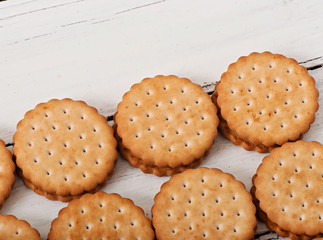 Tasty baked cookies on old wooden background.
