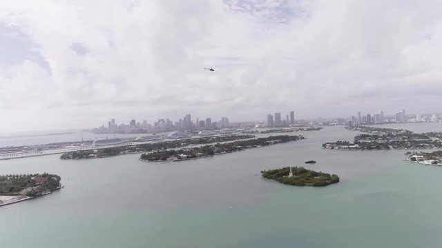 Helicopter Flying Over City of Miami Florida Bay and Downtown